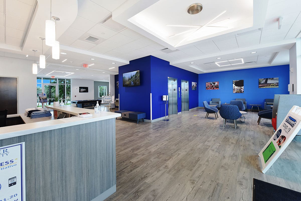 Keiser University’s reception area with navy walls and chairs.