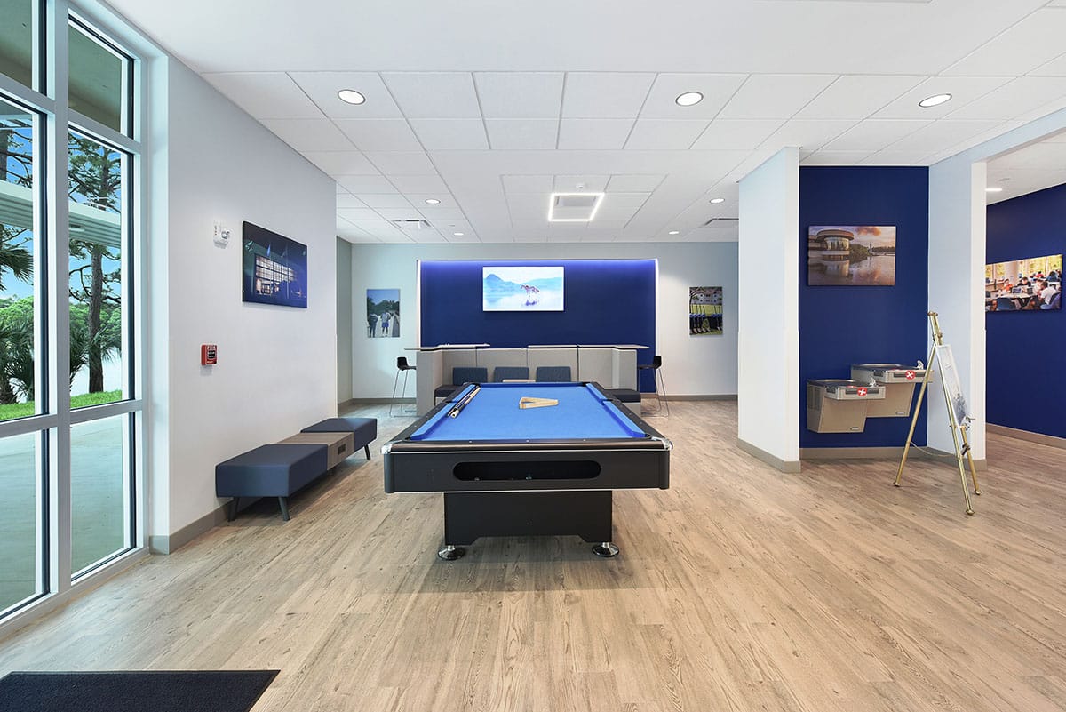 Recreation area with a pool table and water fountain