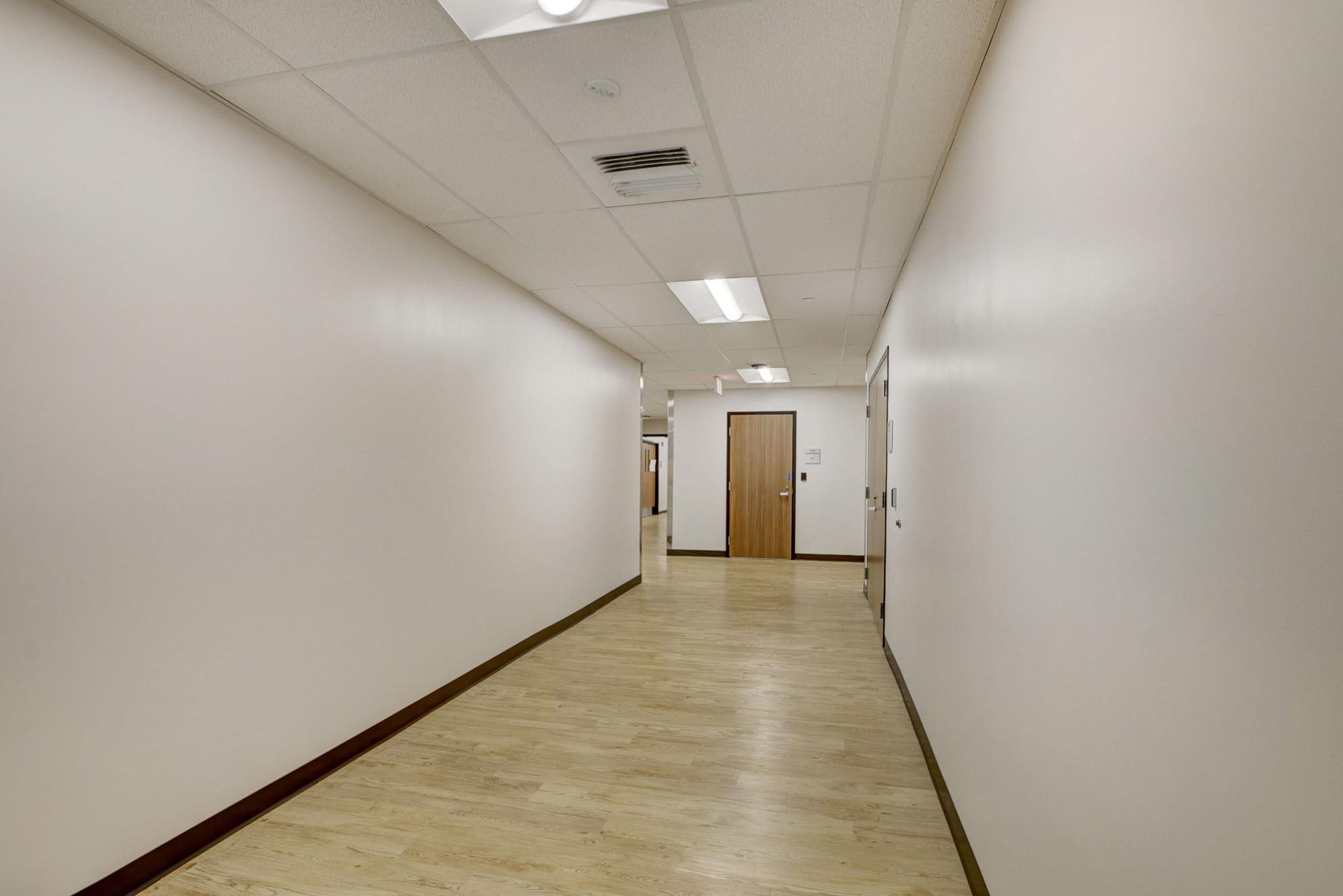 light tan colored vinyl wood flooring in hallway at Palm Beach Sheriff's offices